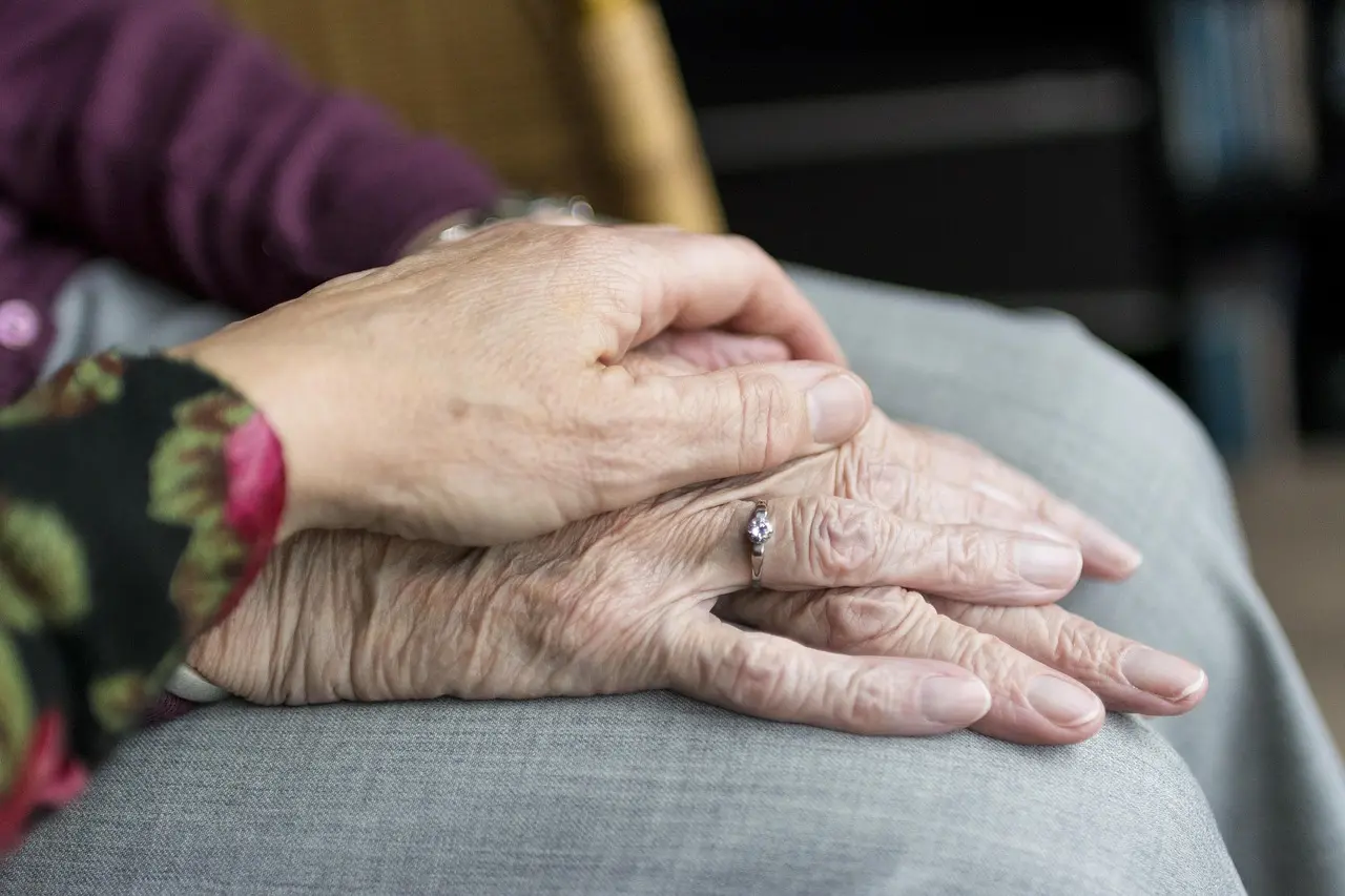Supportive hands held together, symbolizing help through depression