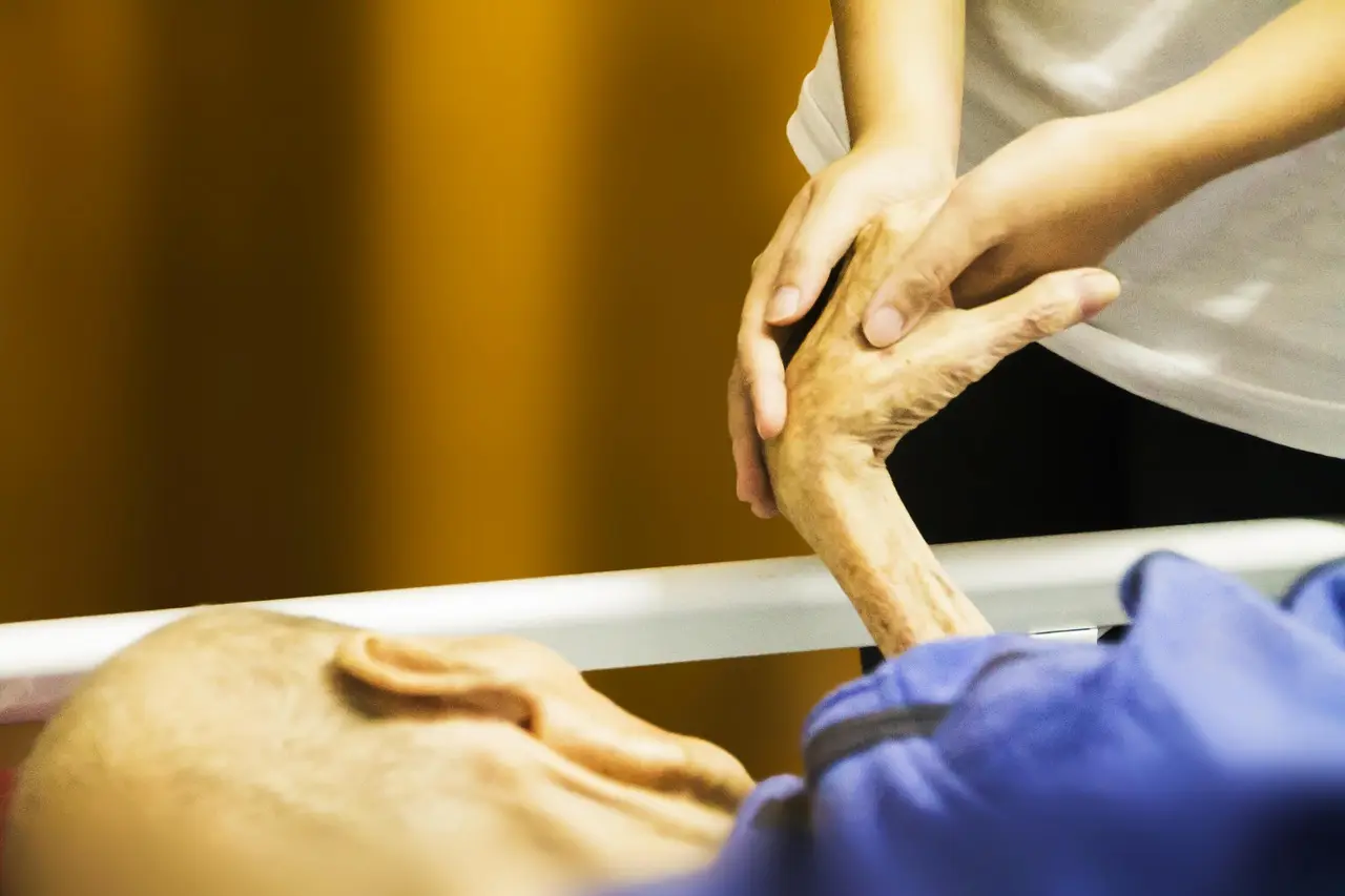 Hands held in a gesture of comfort and support