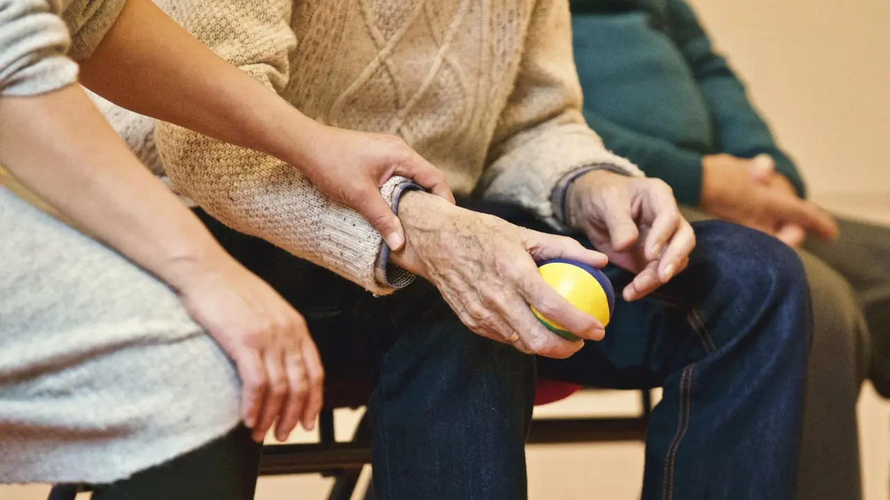 Hands held in a gesture of comfort and support