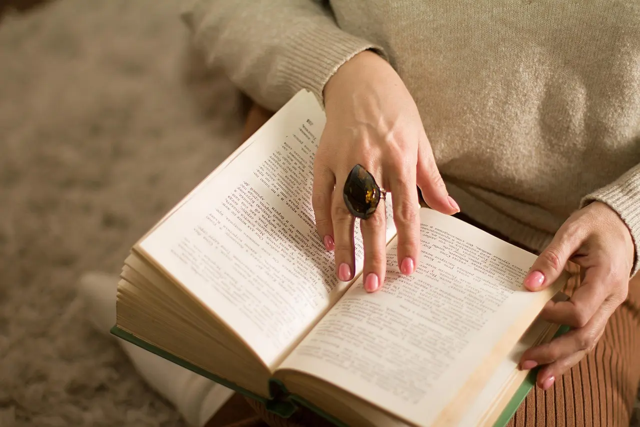 A person reading through educational mental health materials