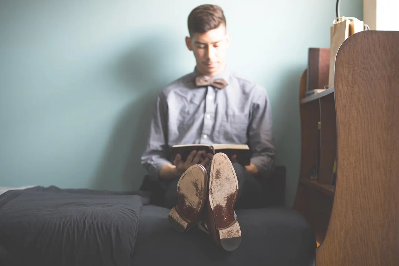 A person reading a guide to mental health support options