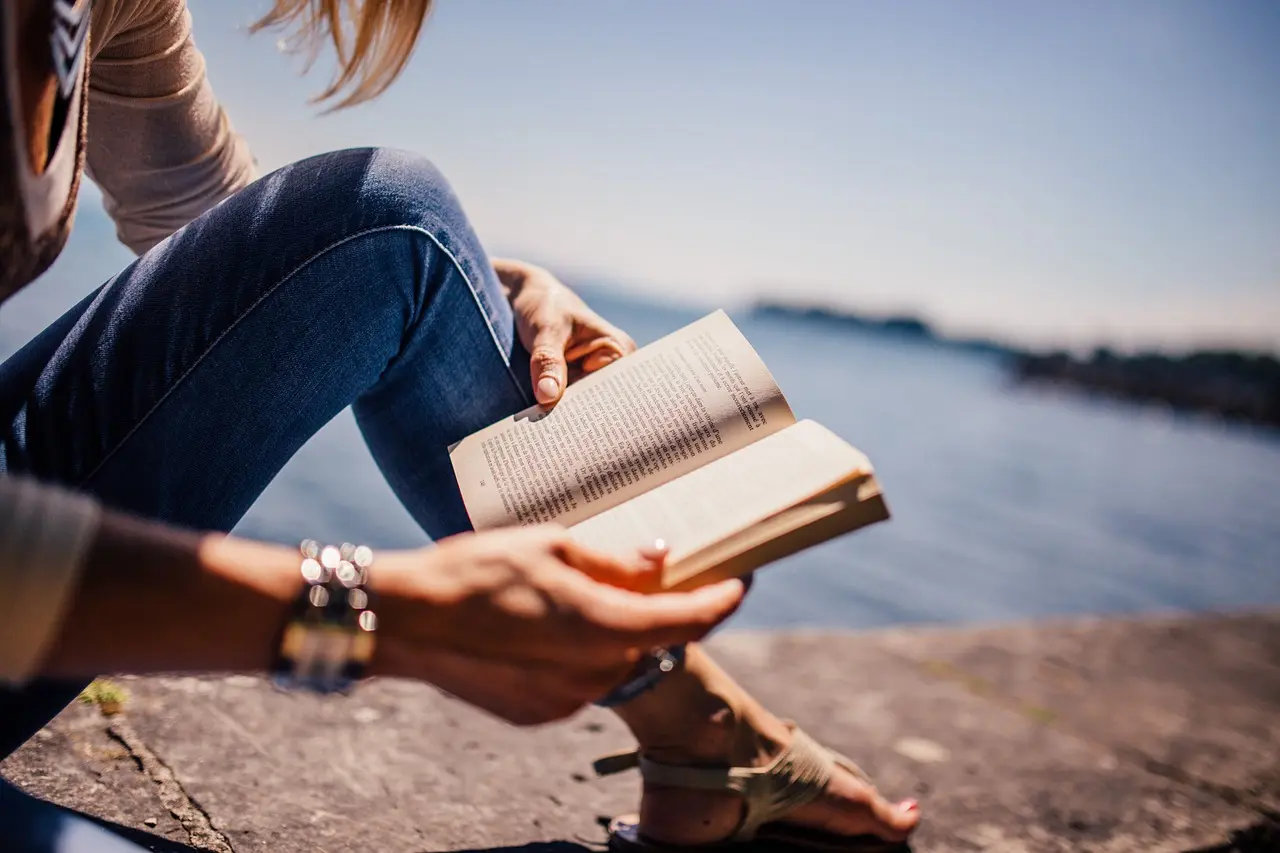 A person reading quietly at home