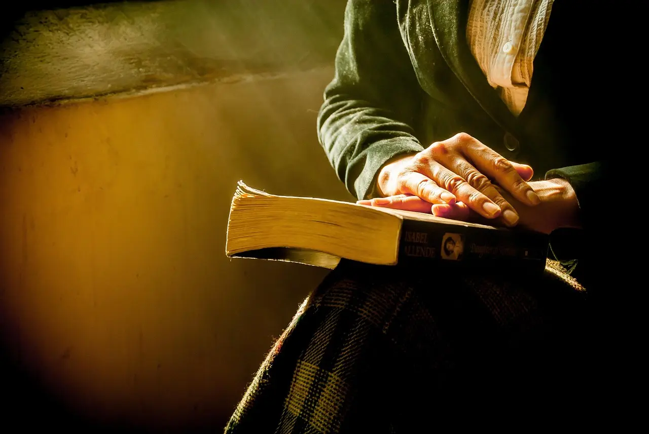 A person reading quietly at home